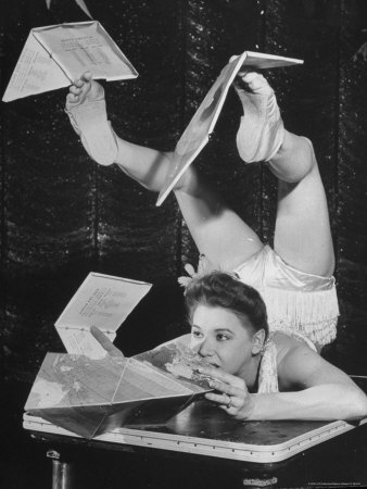 Contortionist assembling Buckminster Fuller cubo-octahedron Dymaxion map